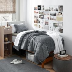 a bedroom with white walls and grey carpet