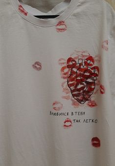 a white t - shirt with red lipstick imprints on it that says, babornac & teeth talk aeko