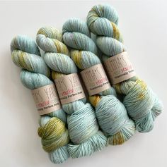 several skeins of yarn sitting on top of each other