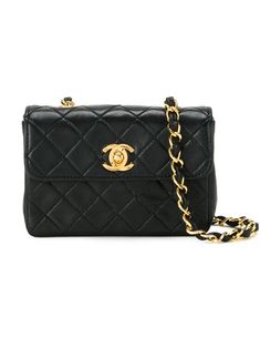 Black lambskin small quilted crossbody bag from Chanel Pre-Owned featuring a gold-tone logo plaque, a chain and leather strap, foldover top with twist-lock closure and an internal logo stamp. Please note that pre-owned items are not new and therefore might have minor imperfections. Black Crossbody Bag Chanel, Crossbody Bag Black, Shopping Chanel, Quilted Crossbody Bag, Chanel 2, Iconic Bags, Small Quilts, Boots Fall, Logo Stamp