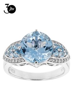 3.79ct 10mm round Glacier Topaz���, .32ctw mixed round Swiss blue topaz, and .19ctw round white zircon sterling silver ring.  Measures approximately 7/16"L x 1/16"W.  Rhodium plated.  Not sizeable. Accent Stones Primarily Zircon. Sky Blue Topaz, Zircon Ring, Swiss Blue Topaz, Rhodium Plated, Blue Topaz, Sterling Silver Ring, Sky Blue, Blue Sky, Silver Ring