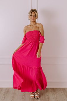 - Say hello to summer maxi vibes with this beautiful dress! - Unlined material - A square cut neckline - Elastic flutter sleeves - A smocked bodice - A flowy yet flattering silhouette that ends in a maxi length hemline Spring Maxi Dress With Elastic Shoulders, Pink Summer Dress With Elastic Neckline, Pink Summer Dresses With Elastic Neckline, Pink Strapless Maxi Dress With Ruffles, Pink Elastic Neckline Summer Dresses, Pink Ruched Summer Maxi Dress, Pink Bohemian Ruched Maxi Dress, Pink Ruched Maxi Dress For Summer, Pink Vacation Dress With Elastic Neckline