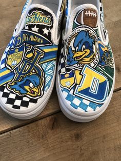 Custom, hand painted slip on Vans University of Delaware Blue Hens sneakers. Can be done in Converse with your school or logo! Contact me to create your custom pair! Custom Hand Painted Blue Sneakers, Custom Blue Hand Painted Sneakers, Artistic Blue Custom Sneakers With Waterproof Paint, Artistic Custom Blue Sneakers For Streetwear, Artistic Blue Custom Sneakers For Streetwear, Artistic Blue Sneakers For Streetwear, Artistic Blue Sneakers With Custom Artwork, Blue Casual Custom Sneakers, Blue Hand Painted Custom Sneakers For Streetwear