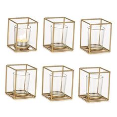 set of four gold metal and glass candle holders