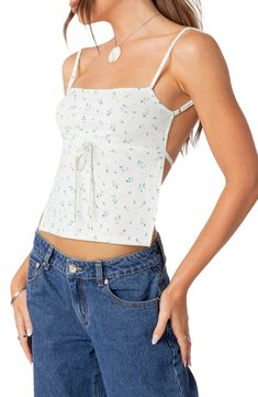 Throw it back to the golden days of Y2K in this babydoll-inspired top blooming with tiny flowers and finished with a daring open back tied with slim laces. Square neck 95% polyester, 5% spandex Machine wash, dry flat Imported Spring Backless Tie-back Tops, White Backless Summer Tops, Spring Backless Top With Tie Straps, Summer Tie-strap Backless Tops, Summer Backless Top With Tie Straps, Cotton Backless Top With Tie Back, Cotton Tie Back Backless Top, Cotton Tie-back Backless Top, White Ditsy Floral Print Summer Top