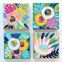 three paintings with flowers painted on them