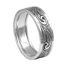 a wedding ring with an intricate design on the outside and inside, in white gold