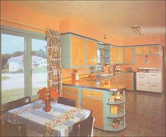 a kitchen with an oven, table and chairs next to a window in the room