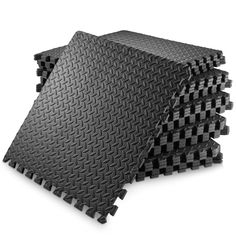 three pieces of black foam are stacked on top of each other in the shape of squares