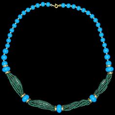 **Details - Era: 1960s-1970s - Shape: Beaded necklace - Style: Statement, Vintage, Retro - Color: Turquoise Blue, Green - Size: 18" long - Fabric: Beads, gold-tone metal spacers **Measurements - Length: 18 inches **Additional Features - Features turquoise blue round beads and green seed beads. - Gold-tone metal spacers provide a beautiful accent. - Timeless and collectible vintage piece, perfect for retro fashion lovers. - Signed "Trifari TM" clasp. Saint Augustine, Vintage Trifari, Color Turquoise, Fabric Beads, Retro Color, Style Statement, Green Bead, Blue Beads, Gold Tone Metal