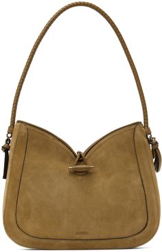 Calfskin suede shoulder bag in brown. Buffed leather trim throughout. · Tassels at braided leather shoulder strap · Logo embossed at face · Logo plaque at side · Toggle closure · Zip pocket at interior · Cotton twill lining · Logo-engraved gold-tone hardware · H10 x W12.5 x D2.25 in Supplier color: Camel Gold Foil Logo, Face Logo, Parisian Chic, Braided Leather, Leather Trim, Hobo Bag, Luxury Streetwear, Isabel Marant, Smooth Leather