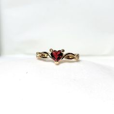 18k Yellow Gold Heart Shaped Ruby July Birthstone Delicate Dainty Ring Size 7 18k Yellow Gold Plated This Ring Is True To Its Beauty!!! The Detail And Sheer Sparkle Is Absolutely Stunning!! Wear Your Heart On Your Finger, Or Gift This To The Love Of Your Life! This Heart Shaped Solitaire Gemstone Sits Pretty On A 18k Yellow Gold Plated Band. This Lab Created Ruby Is A Shiny Red Gem Teeming With Fire And Brilliance. #Goldplated #Ringsize7 #Size7ring #Julybirthstone #Ruby Red Fashion Gold Plated H Gold Red Rings, Heart Shaped Gold Ring, Red Gold Ring, Gold And Ruby Jewelry, 14k Gold Heart Cut Red Jewelry, Gold Ruby Ring For Valentine's Day, Red 14k Gold Heart Cut Jewelry, Gold Ruby Ring With Vs Clarity For Wedding, Gold Vs Ruby Ring For Wedding