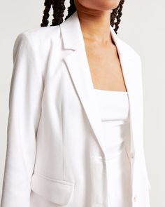 Elevate your wardrobe with the Abercrombie & Fitch Women's Linen-Blend Blazer in pristine white. This blazer is a testament to timeless style and sophistication, perfect for both office and casual outings.

- Size: XXS
- Color: White
- Material: Shell - Linen, Viscose; Lining - Polyester
- Gender: Female
- Features: Classic-fit silhouette, single-breasted design, side pockets, center-button closure

Crafted from a luxurious linen-viscose blend, this blazer offers breathability and comfort, makin Classic Linen Blazer For Office, Classic Linen Office Blazer, Fitted Double Button Summer Blazer, Fitted Summer Blazer With Double Button Closure, Classic Linen Blazer With Double Button Closure, Summer Formal Blazer With Button Closure, Chic Linen Blazer For Business, Chic Linen Business Blazer, Chic Linen Business Suits