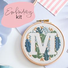 an embroidery kit with the letter m on it