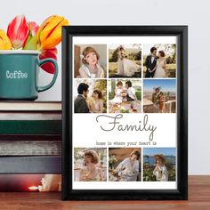 a coffee mug sitting on top of a wooden table next to a framed photo and flowers