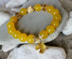 "Yellow Aventurine Bracelet, 12mm Aventurine Bracelet, Libra Bracelet, Aries Bracelet, Chakra Bracelet, Heart Bracelet, Yellow Bracelet, Aventurine Wrist Mala, Gorgeous energy bracelet made of 12 mm. yellow Aventurine beads, crystals, shamballa bead and golden components. The beads are strung on elastic silicone cord. I'm sure this bracelet will bring love, spiritual calm, harmony and good emotions to you! Reiki charged and ready to ship. Choose your wrist's size with an option. 5.5\" - 14 cm. 6 Yellow Gemstone Beads Crystal Bracelet For Gift, Yellow Crystal Bracelet With Gemstone Beads As Gift, Yellow Gemstone Beads Crystal Bracelet, Yellow Crystal Healing Bracelet With Round Beads, Yellow Crystal Bracelet With Round Beads For Healing, Yellow Spiritual Crystal Bracelet With 8mm Beads, Libra Bracelet, Aries Birthstone, Aries Bracelet