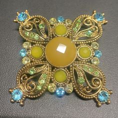 Beautiful Gold Filled Brooch/Pendant. Size Is 2”*2”. Heavy. Looks Gorgeous And Bright. Excellent Condition Multicolor Round Brooch Jewelry, Yellow Gold Multi-stone Brooches As Gift, Luxury Multicolor Brooches For Gifts, Luxury Multicolor Brooches As Gift, Yellow Brooch Jewelry For Wedding, Elegant Blue Jeweled Brooches, Yellow Wedding Jewelry Brooch, Elegant Yellow Brooches For Gifts, Gold Gemstone Round Brooch