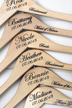 personalized wooden wedding hangers with names and date engraved on them, set of 10