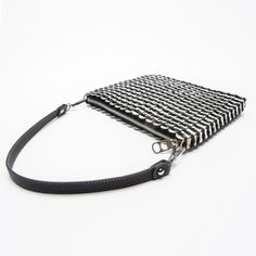 Versatile purse made from up-cycled pop tabs. Converts with leather shoulder strap and detachable hands-free long chain. Beautifully finished with silver fabric liner, custom metal zipper and one inside zipped pocket. 9”W x 7”H x 1” D (expandable). Leather shoulder strap drop: 9” Chain strap length 40", strap drop 20" Hip Pouch, Silver Purse, Pop Tabs, Best Purses, Silver Fabric, Strap Bag, Soda Pop, Brocade Fabric, Small Shoulder Bag