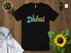 Stand out with this vibrant Dubai graphic T-shirt featuring a colorful and unique Dubai skyline with a Burj Al Arab illustration. Perfect for Dubai lovers and travel enthusiasts, this tee adds a splash of color to your wardrobe. Whether you're reminiscing about your trip or dreaming of your next adventure, this stylish shirt is a must-have. Multicolor Rainbow Print Short Sleeve T-shirt, Rainbow Print Short Sleeve T-shirt, Burj Al Arab, Stylish Shirts, Dubai, Color Splash, Clothing Items, Graphic Tshirt, Bathing Beauties