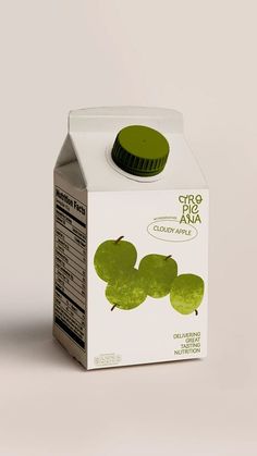 a carton of green apple juice on a white background