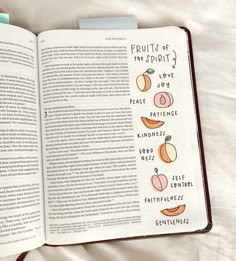 an open book with fruit illustrations on it