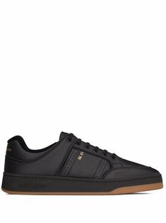 Black leather blend low-top trainers from SAINT LAURENT featuring front lace-up fastening, embossed logo to the side and flat rubber sole. | Saint Laurent Low-Top Trainers Black Designer Sneakers, Designer Sneakers For Men, Saint Laurent Sneakers, Number 7, Sneakers For Men, Saint Laurent Shoes, Designer Sneakers, Embossed Logo, Black Design