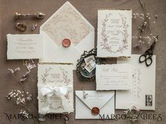 the wedding stationery is laid out and ready to be put into the bride's bouquet