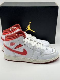 Elevate your sneaker game with these limited edition Air Jordan 1 Mid SE in White/ Lobster-Dune Red-Sail. These classic high top shoes are perfect for any occasion, whether you’re looking for activewear, casual, or workwear. The lace-up closure ensures a secure fit while the leather outsole provides durability and style. This shoe features a color-block pattern and silhouette that pays homage to Michael Jordan himself. It comes in a size 7 US shoe size, 6 UK shoe size, and 40 EU shoe size. These sneakers are perfect for any season, be it winter, summer, fall, or spring. With such a versatile shoe, you can use it for a wide range of performance activities such as volleyball, cross-training, basketball, football, and much more. Training Basketball, Air Jordan 1 Mid Se, Jordan 23, Sneaker Games, Air Jordan 1 Low, Block Pattern, Jordan 1 Low, Air Jordan 1 Mid, Jordan 1 Mid