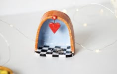 a heart shaped object sitting on top of a table