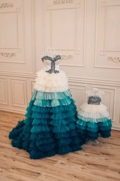 two dresses on display in a room