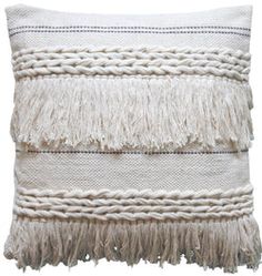 a white pillow with fringes on it