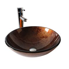 a brown bowl sink sitting under a faucet