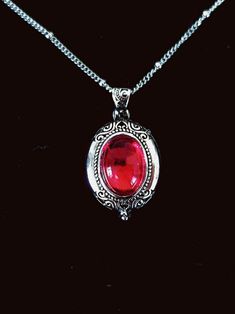 Vintage Style Silver Oval Ruby Locket Victorian Jewellery Red - Etsy Vintage Red Round Pendant Jewelry, Ornate Red Cabochon Jewelry, Ornate Oval Pendant Necklace With Vintage Charm, Formal Red Medallion-shaped Jewelry, Antique Nickel-free Necklace For Valentine's Day, Elegant Red Locket Necklaces, Red Locket Necklace For Formal Occasions, Red Jewelry For Valentine's Day Keepsake, Red Medallion Necklace For Formal Occasions