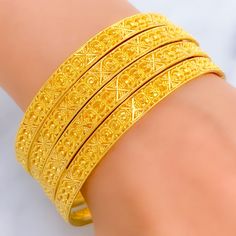 This festive set consists of four bangles, each crafted from 22k yellow gold, weighing a total of 47.9 grams. Embellished with shiny beadwork, these bangles shine with a celebratory sparkle, making them a perfect addition to any festive occasion. Sized at 2.7 with an opening of 2.45 inches, they are designed to fit comfortably while providing a dazzling display of craftsmanship. The beadwork adds texture and depth to the bangles, enhancing their visual appeal and making them stand out in any jewelry collection. Ideal for those looking to add a touch of festivity and elegance to their attire, these bangles merge traditional design with a modern twist. PRODUCT DETAILS Gold Purity(karat): 22k Gold Weight(grams): 47.9 Item Finish: Yellow Gold Bangle Size: 2.7 Bangle Opening: ﻿2.45" Number Of P Yellow Gold Bangle For Festivals, Yellow Bracelets With Intricate Design For Festivals, 22k Gold Bangle Bracelet For Festive Occasions, Festive 22k Gold Bangle Bracelet, Traditional Yellow Gold Bracelet For Festive Occasion, Festive Yellow Gold Bangle Gift, Festive Yellow Gold Bracelets For Festivals, Yellow Traditional Gold Bracelet For Festive Occasions, Yellow Gold Bangle For Diwali Gift