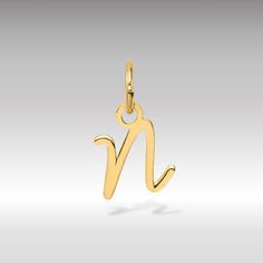 "They say, \"Simplicity is the ultimate sophistication,\" and the 14K Gold Script Letter \"N\" Initial Pendant embodies this sentiment flawlessly. Crafted with precision and finesse, this pendant features a minimalist script design that exudes understated elegance. Fashioned from high-quality 14-karat gold, it adds a touch of sophistication to any ensemble. The sleek script letter design of this pendant brings a personalized touch to your look. Whether you're dressing up for a special occasion or keeping it casual, the 14K Gold Script Letter \"N\" Initial Pendant effortlessly enhances your style with its timeless allure. Pair it with your preferred chain - whether it's a box, rope, cable, or wheat - to create a look that's both chic and versatile. Embrace the classic elegance of the 14K Go N Pendant Letter Gold, N Initial, Script Design, Letter N, Script Lettering, Letter Design, Personalized Pendant, Initial Pendant, Understated Elegance