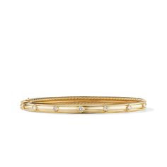 This bracelet is made of 18K yellow gold and features diamonds as its primary gemstone. It belongs to the Renaissance collection. David Yurman Stacked Bracelets, David Yurman Watch, Bracelet Stacks, Cable Bracelets, Classical Design, Modern Watches, Diamond Guide, Metal Shop, David Yurman