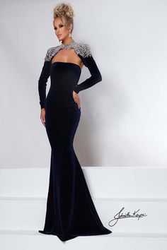 Looking for a show-stopping pageant gown? Look no further than the Johnathan Kayne 2453! This gorgeous stretch velvet gown comes with a crystal-covered bolero jacket and detachable charmeuse cape. You'll be unstoppable on stage and off in this beautiful dress!