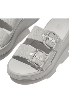 Glittery straps elevate this platform sandal designed with a contoured footbed and mircofiber-lined straps for signature comfort. 1 1/2" platform Adjustable midfoot straps with buckle closure Cushioned footbed with arch support Slip-resistant sole Synthetic upper and lining/rubber sole Imported Buckle Sandals, Designer Sandals, Sandal Women, Arch Support, Platform Sandals, Rubber Sole, Womens Sandals, Arch, Nordstrom