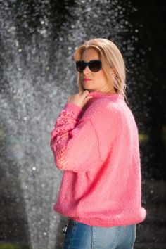 "Pink Mohair blend sweater. Summer top - loose and soft, made by a soft mohair blend yarn. V neck with ties. Lace pattern on sleeves Non itchy . This gorgeous sweater is a great choice for your summer walks, along the beach or in the nature. Its the perfect choice for your city style as well! Fits S and M sizes best Oversized style. 100 % hand knitted Mesurements: Body lenght: 24 \" / 60 cm Chest width: 25\" / 62 cm All measurments are taken with the item flat and not streched. Please check care Pink Mohair Sweater For Winter, Pink Open Knit Winter Sweater, Pink Open Knit Sweater For Winter, Winter Pink Open Knit Sweater, Pink Mohair Sweater For Spring, Pink Mohair Knitted Cardigan, Hand Knitted Pink Mohair Sweater, Cozy Pink Mohair Sweater, Pink Hand Knitted Long Sleeve Sweater