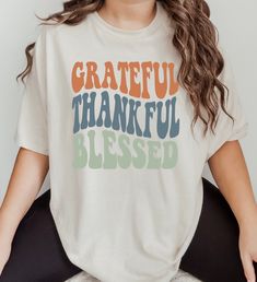 | description. |  Grateful, Thankful, Blessed shirt | materials. | ☼ Shirt brands may vary from time to time, depending on current inventories. All shirts are unisex sizing and will be a Bella + Canvas or Gildan Softstyle; which both have a soft feel. ☼ 100 % cotton; all heather gray shirts are 90% cotton & 10% polyester. ☼ Both brands of shirt are pre-shrunk and have tear away labels for comfort. ☼ All of our shirts are professionally heat pressed with high quality materials. | info. | ☼While t Teacher Gifts Thanksgiving, Thankful Grateful Blessed Shirt, Halloween Shirts For Women, Blessed Shirt, Thanksgiving Tee, Grateful Thankful Blessed, Halloween Shirts, Fall Shirt, Shirts For Women