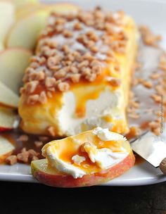 an apple dessert on a white plate with apples