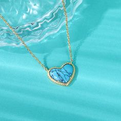 Lending a cool vibe to your look, this necklace makes a fitting choice for everyday wear. We love the textured heart shaped blue stone which gives it a touch of premium appeal while maintaining its elegance. It is suspended from a yellow gold tone sterling silver chain. Whether chosen as a gift or just for you, the details of this necklace were designed to be adored. Pair the heart-cut turquoise necklace with your favorite delicate pieces for a lovable layered look.Carat Weight: 2.1 ctStone Size Blue Heart Pendant Clavicle Chain Jewelry, Elegant Turquoise Necklace With Heart Charm, Trendy Turquoise Necklace For Gift, Blue Heart-shaped Clavicle Chain Necklace, Blue Heart Pendant Necklace As Gift For Her, Blue Heart Shaped Clavicle Chain Necklace, Blue Heart Clavicle Chain Necklace, Trendy Blue Heart-shaped Jewelry, Blue Turquoise Heart Pendant Necklace