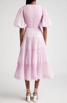 Inspired by snapshots of dance halls from the '50s, this pleated midi dress showcases voluminous sleeves and a tiered skirt lifted by a layer of crinoline. 49 1/2" length (size 8US) Hidden back-zip closure Deep V-neck with button-and-loop closure Elbow-length sleeves with elastic cuffs Lined except sleeves 100% polyester Dry clean Imported Designer Clothing Modest Looks, Designer Clothing Brands, Voluminous Sleeves, Yellow Midi Dress, Dream Dresses, Linen Midi Dress, Tiered Midi Dress, Silk Midi Dress, Cotton Midi Dress