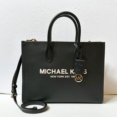 New With Tag Michael Kors Mirella Medium East West Tote Satchel Shoulder Bag Pebbled Leather Black Multi 100% Authentic Retail: $558.00 Plus Tax **Please See The Measurement For The Size** No Dust Bag Michael Kors Logo At Front Gold Toned Hardware Custom Fabric Lining 1 Zipper Pocket 1 Slip-In Pocket 13.75" (Bottom) X 10.75"(H) X 4.75"(D) Straps: 4.5", Adjustable Longer Strap Very Clean, Smoke-Free And Pet-Free Environment. Chic Michael Kors Bag With Logo, Michael Kors Top Handle Shoulder Bag With Logo, Chic Michael Kors Shoulder Bag With Logo, Black Rectangular Satchel With Logo, Logo Satchel For Shopping, Black Leather Satchel With Logo, Black Top Handle Satchel With Logo, Chic Satchel With Logo For Shopping, Elegant Daily Use Satchel With Logo