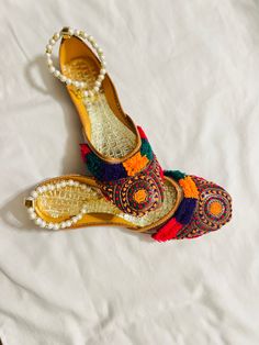 This is a traditional Afghani slipper (paissare) which can be worn during any event Traditional Festive Sandals For Party, Traditional Festive Party Sandals, Traditional Handmade Sandals For Party, Traditional Party Sandals With Gota Work, Traditional Gota Work Sandals For Party, Traditional Sandals With Dori Work For Festivals, Traditional Sandals For Festivals And Parties, Traditional Closed Toe Sandals For Festive Occasions, Festive Multicolor Flat Sandals