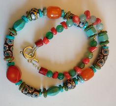 An eye catching Coral, Turquoise and mixture of African trade beads necklace.  Please note colours may appear different based on your monitor, lighting, etc. Sadly, some items are camera shy, making this task especially difficult. I do my best to represent the accurate colour. All items are carefully hand packaged in gift boxes to ensure they arrive in perfect condition. I will ship your order within 1 - 3 business days and all items are sent via the UK Royal Mail signed for service.  **If you w Beaded Necklaces With Round Beads For Festivals, Large Beads For Festival Gifts, Festival Gift Necklaces With Colorful Beads, Unique Beaded Necklaces For Festivals Gift, Festival Gift Necklace With Colorful Beads, Round Beaded Necklaces For Festivals And Gifts, Round Beaded Necklaces For Festivals As Gifts, Festive Necklaces With Colorful Beads For Gifts, Festive Gift Necklaces With Colorful Beads