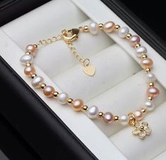 The pearls are individually hand-knotted on color-matching silk thread so that no two pearls ever rub against each other, and if the bracelet ever snaps, you won't lose a single pearl. The clasp is composed of solid 14 karat gold with a safety catch mechanism, ensuring your pearls always stay safe and secure.Fair pricing: Luxury and fits in any outfits. Can wear in any occasion. Sizes: 7-8mm.Pearl body color: white Pearl quality: AA grade.Pearl shape: Round Elegant soft touch gift box or pouch t Touch Gift, Single Pearl, Real Pearls, Body Color, Silk Thread, Body Colour, White Pearl, Stay Safe, Pearl White