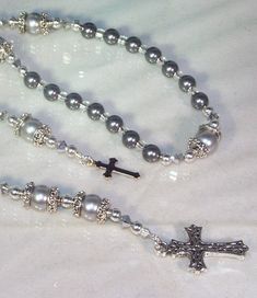 Choose your crystal color, metal finish (silver or gold), cross and connector. All of my pieces are made-to-order (custom). If you don't see what you want, convo me and we'll make it together. Showing in photo: Swarovski pearl Anglican rosary made with 8mm Pewter pearls, 10mm Silver pearls, silver beads, silver lined glass seed beads and Comet Argent Swarovski crystal bicones. This rosary can be made with your choice of a silver or gold connector and a silver or gold crucifix/cross. Take a look Anglican Rosary, Pearl Rosary, Silver Line, Gold Cross, Swarovski Pearls, Silver Pearls, Rosary, Silver Beads, Swarovski Crystal