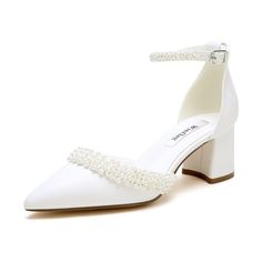 a white high heeled shoe with pearls on the ankle